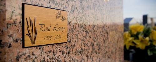 Wooden commemorative plaque created with a funeral engraving machine