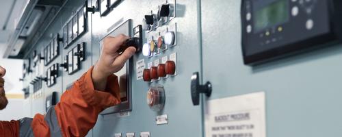 Engineer ensures ship operations on control panel